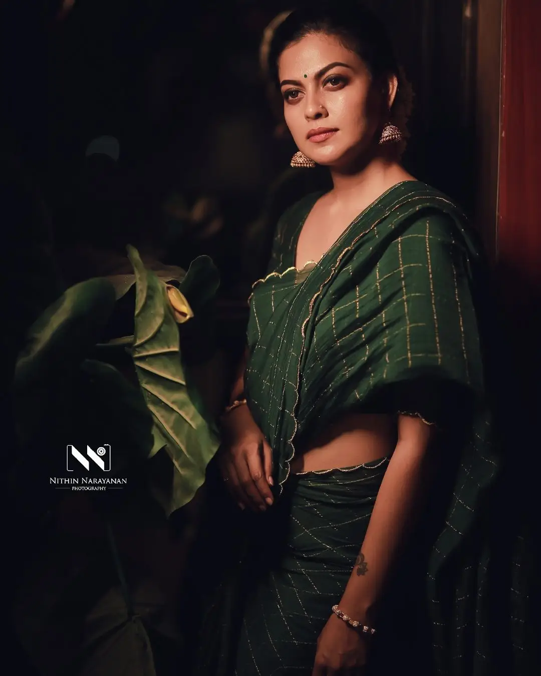 Anusree Nair Wearing Beautiful Earrings Jewellery Green Saree Blouse